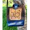 Hand Carved & finished outside pocket hand sewn onto the front of the bag.
